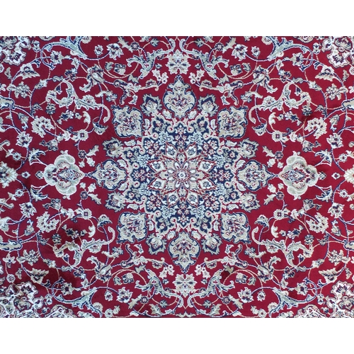 2135 - Rectangular Keshan design red ground floral rug, 200cm x 140cm