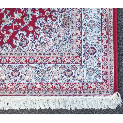 2135 - Rectangular Keshan design red ground floral rug, 200cm x 140cm