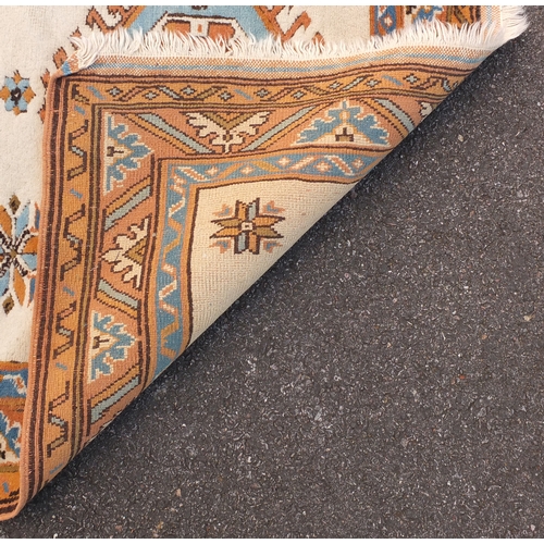 99A - Turkish beige ground rug with geometric pattern 170cm x 100cm