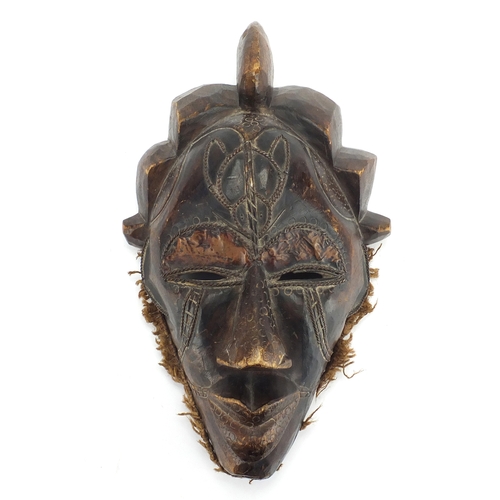 806 - African carved wood wall mask with wire inlay, 42cm in length