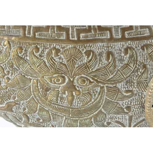 799 - Middle Eastern brass centre piece with mythical animal head handles, 46cm wide
