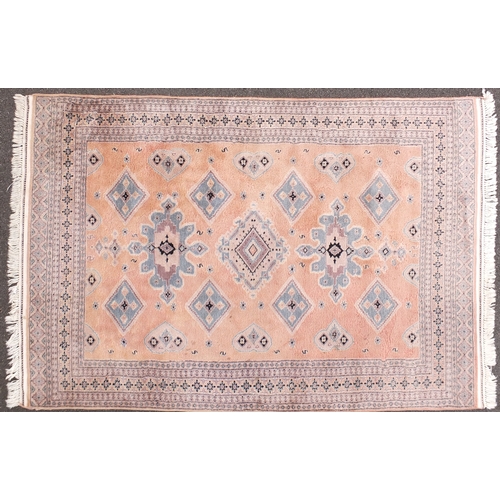 8 - Pink and blue ground rug with geometric design, 270cm x 180cm