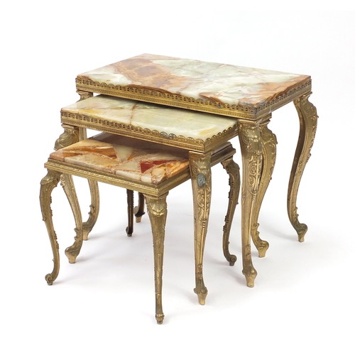 87 - Nest of three onyx and brass tables, the largest 45cm H x 51cm W 30cm D