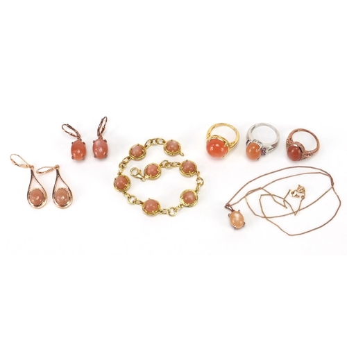 399 - Silver gilt and cabochon pink stone jewellery comprising three rings, bracelet, two pairs of earring... 