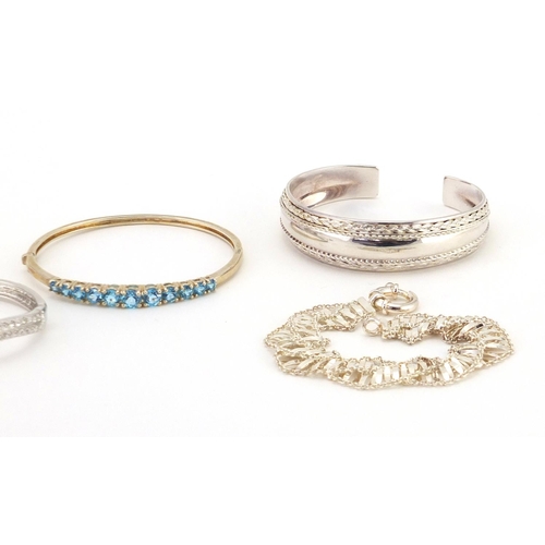 388 - Five silver bracelets and bangles, some set with colourful stones, approximate weight 95.6g