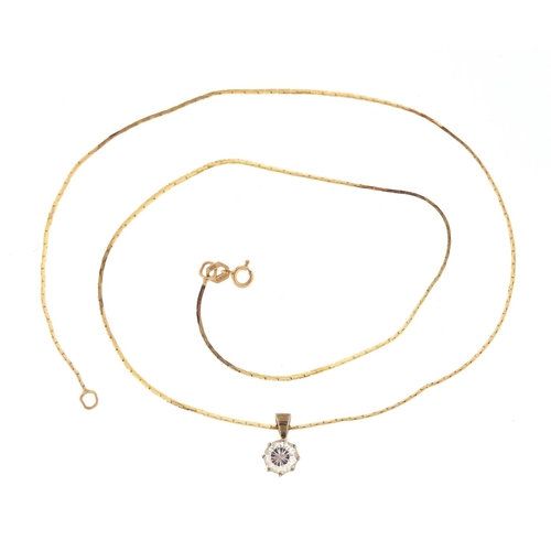 394 - 9ct gold necklace with a silver gilt clear stone pendant, approximate weight of the necklace 2.3g
