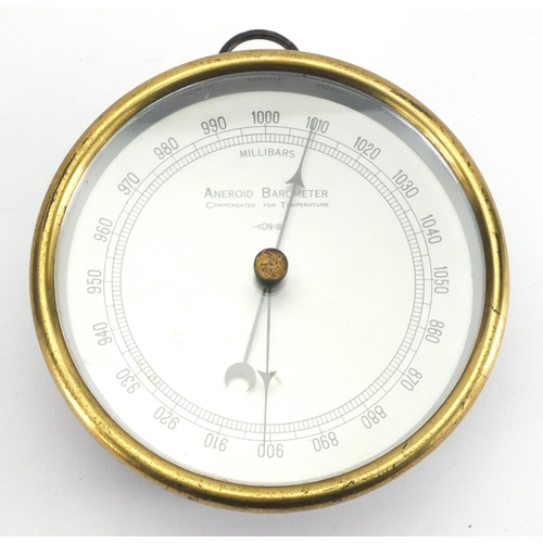 965 - Circular brass framed aneroid barometer, serial number 0357, 13.5cm in diameter