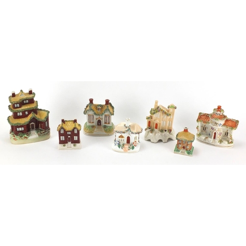 291 - Seven Staffordshire buildings including pastille burners and desk stand, the largest 16.5cm high