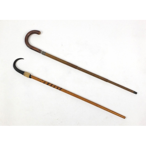 341 - Swiss walking stick with horn handle and one other enclosing a parasol