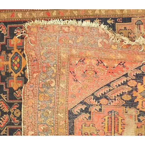 166 - Two Persian rugs, the larger approximately 180cm x 115cm