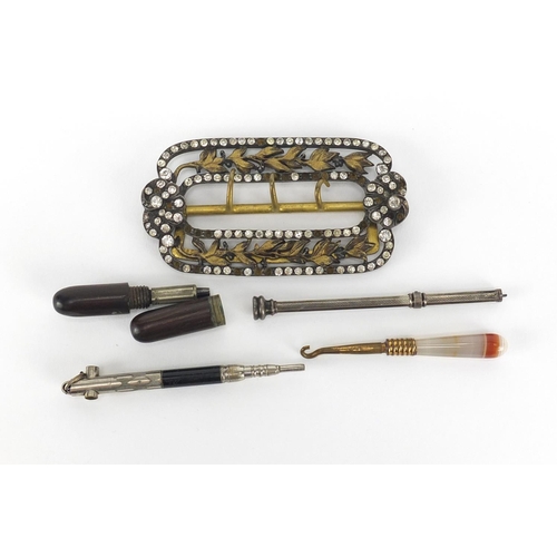 713 - Objects including a gilt metal buckle set with clear stones and a silver propelling pencil