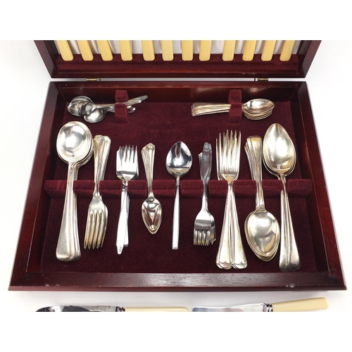481 - Silver plated and stainless steel cutlery housed in a mahogany canteen