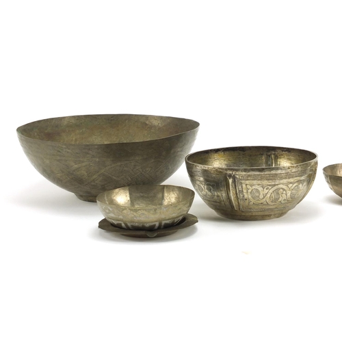 650 - Six Middle Eastern silver coloured metal bowls and an ashtray, the largest 21.5cm in diameter