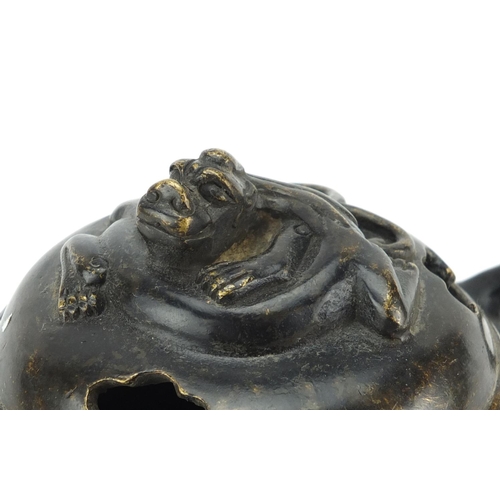 657 - Chinese patinated bronze tripod incense burner and cover with twin handles, character marks to the b... 