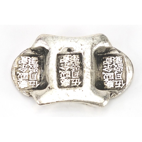 630 - Chinese silver coloured metal scroll weight, 6.5cm wide, approximate weight 143.0g