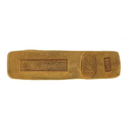 633 - Chinese gold coloured metal scroll weight, 8cm wide, approximate weight 74.0g