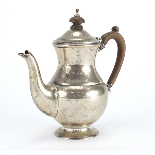 521A - Silver bachelor's coffee pot with wooden handle and knop, by Mappin & Webb London 1930, 15.5cm high,... 