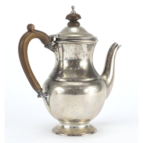 521A - Silver bachelor's coffee pot with wooden handle and knop, by Mappin & Webb London 1930, 15.5cm high,... 