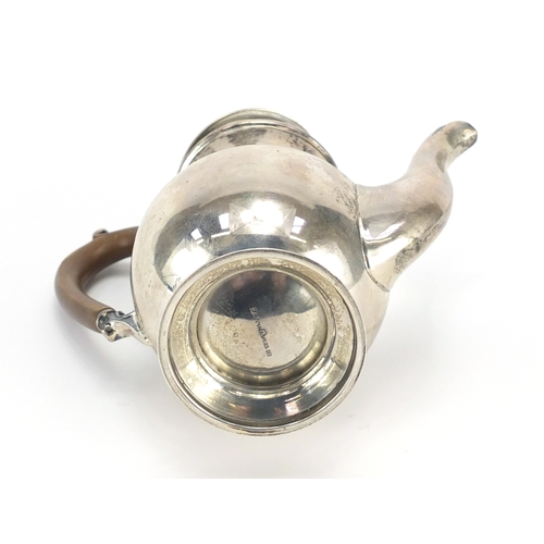 521A - Silver bachelor's coffee pot with wooden handle and knop, by Mappin & Webb London 1930, 15.5cm high,... 