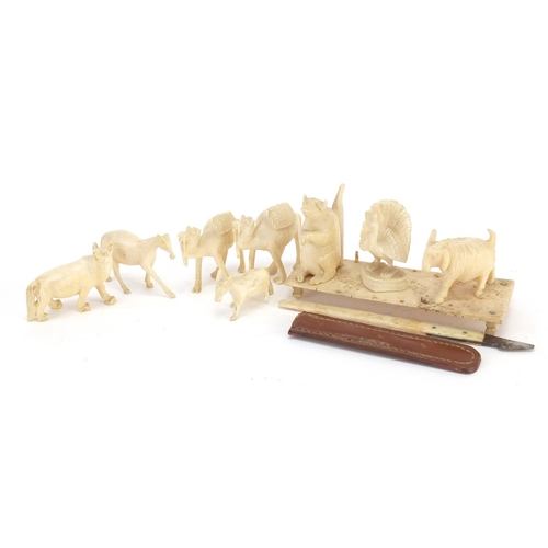 759 - Ivory animals including horse, camel and wolf, the largest 3.4cm high