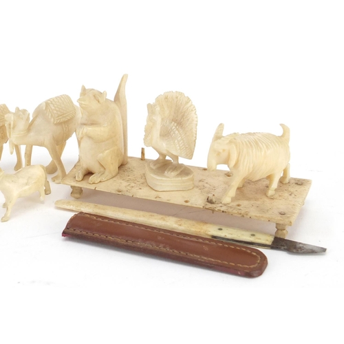 759 - Ivory animals including horse, camel and wolf, the largest 3.4cm high