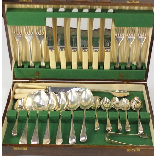 40 - Silver plated and stainless steel cutlery, housed in two oak canteens