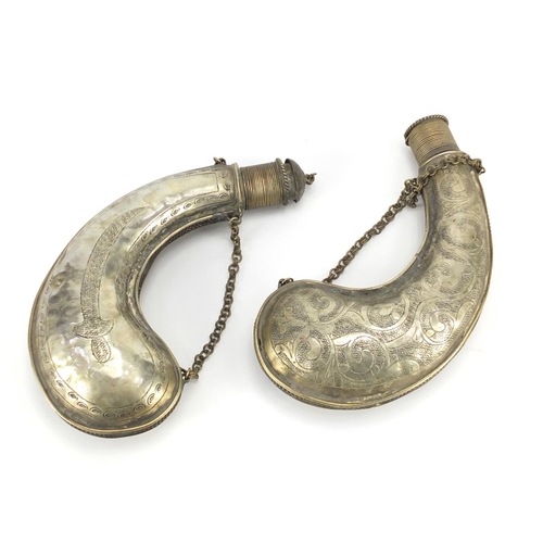 320 - Two Indian white metal powder flasks, each 16cm in length