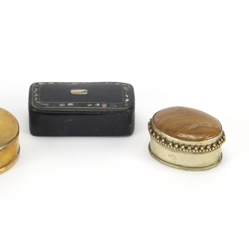 762 - Four snuff boxes including one Georgian papier-mâché example, the largest 12cm in length