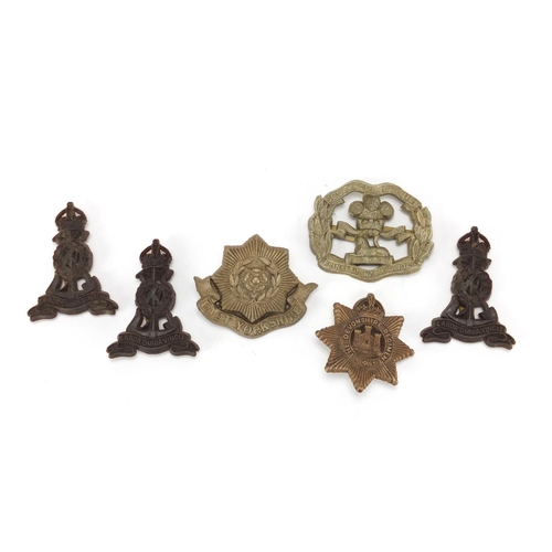 849 - Six Military interest cap badges including East Yorkshire and South Lancashire