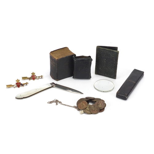 764 - Objects including antique style coins, enamelled badges and miniature leather bound Bible