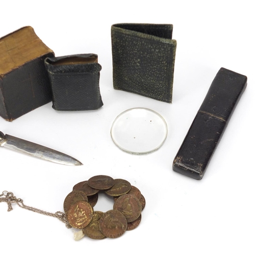 764 - Objects including antique style coins, enamelled badges and miniature leather bound Bible