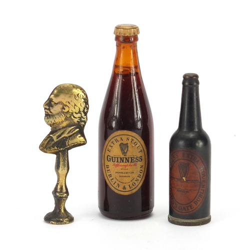 750 - Guinness lighter, alcohol miniature and a brass pipe tamper