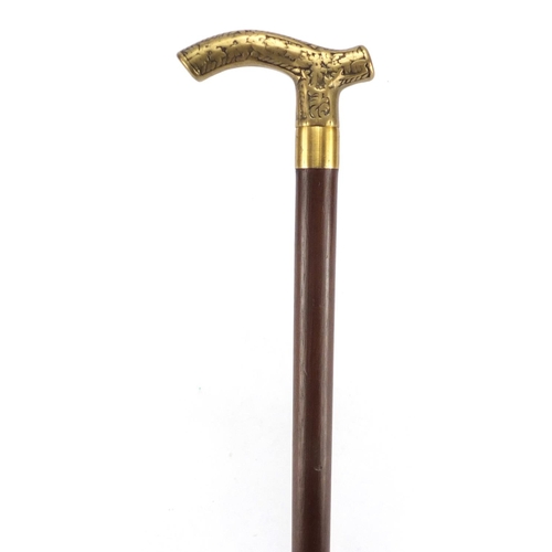 212 - Wooden walking stick with brass handle and concealed drinking vessel, 88cm in length