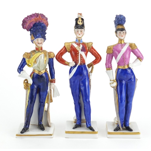 633 - Three 19th century Capodimonte hand painted porcelain soldiers, factory marks to the bases, the larg... 
