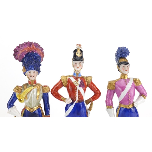 633 - Three 19th century Capodimonte hand painted porcelain soldiers, factory marks to the bases, the larg... 