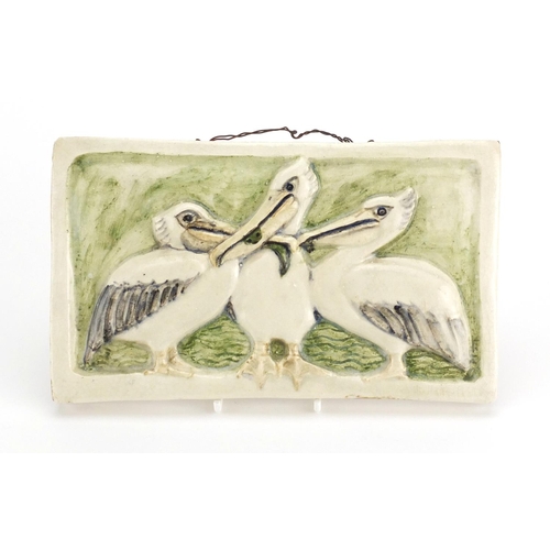 706 - Stella R Crofts hand painted pottery pelican and fish plaque, signed, titled and dated 1939 to the r... 
