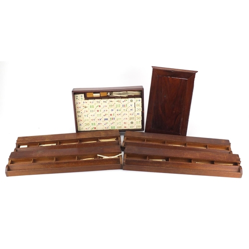 2142 - Bone and bamboo Mahjong set with case and four stands, incised with character marks