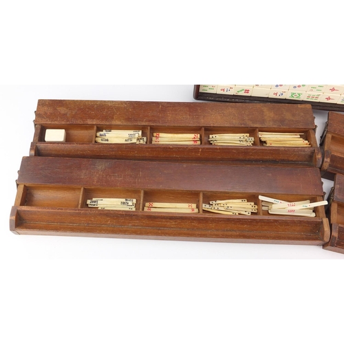 2142 - Bone and bamboo Mahjong set with case and four stands, incised with character marks