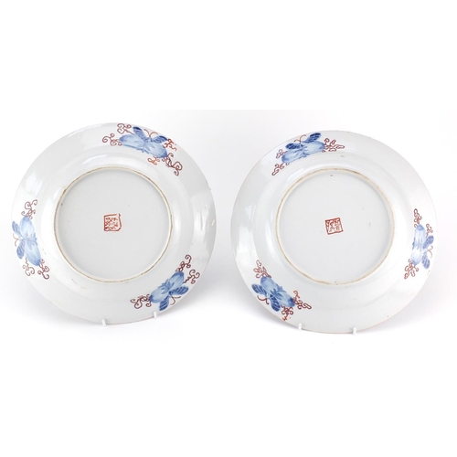 447 - Pair of Japanese porcelain bowls both hand painted with flowers and butterflies, painted marks to th... 