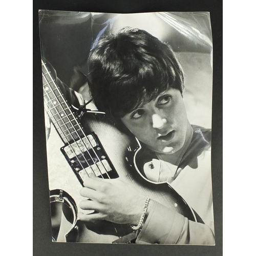 185 - 1960's black and white press photograph of Paul McCartney, inscribed Beatles ATB May 1964 to the rev... 