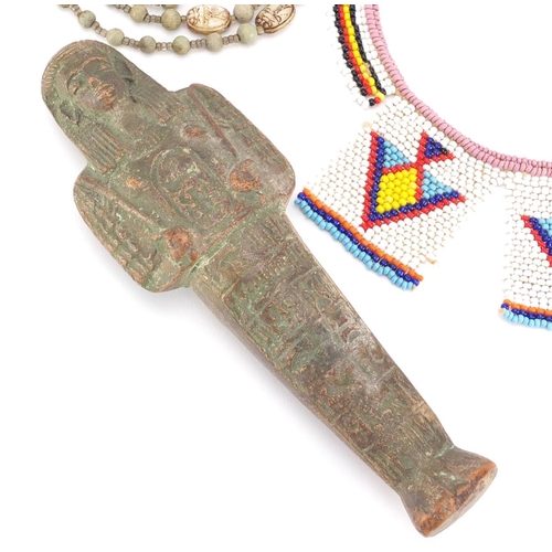 537 - Egyptian ushabti together with a scarab beetle necklace and beadwork necklace, the ushabti 19cm high