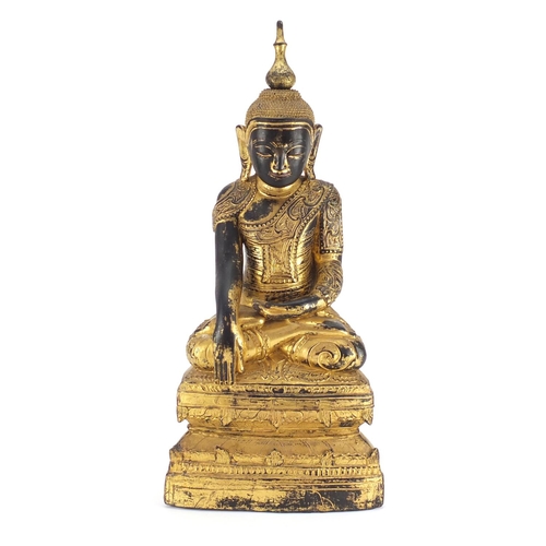 518 - Large antique Burmese carved gilt wood figure of seated Buddha, 60cm high