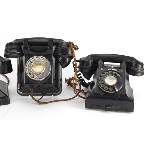 137 - Three vintage black Bakelite telephones including a pyramid example, the largest  20cm high
