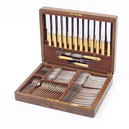 2139 - 1930's oak twelve place canteen of Princes plate cutlery, some with ivorine handles by Mappin & Webb... 