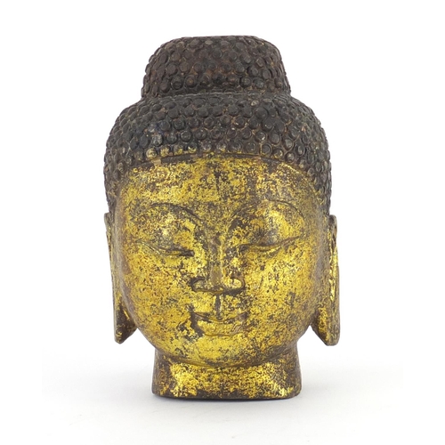 2318 - Carved stone gilded Buddha head, 19cm high