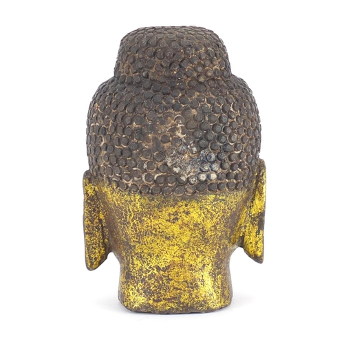 2318 - Carved stone gilded Buddha head, 19cm high