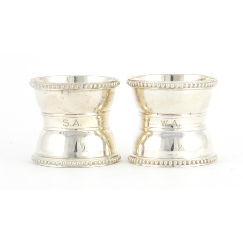 2594 - Pair of Victorian silver napkin rings, indistinct makers mark London 1874, 4.2cm high x 4.6cm in dia... 