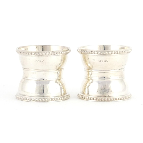2594 - Pair of Victorian silver napkin rings, indistinct makers mark London 1874, 4.2cm high x 4.6cm in dia... 