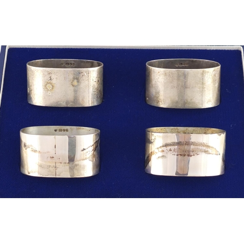 2568 - Set of four oval silver napkin rings, GLB London 1981, with fitted case, 4.8cm wide, 132.2g