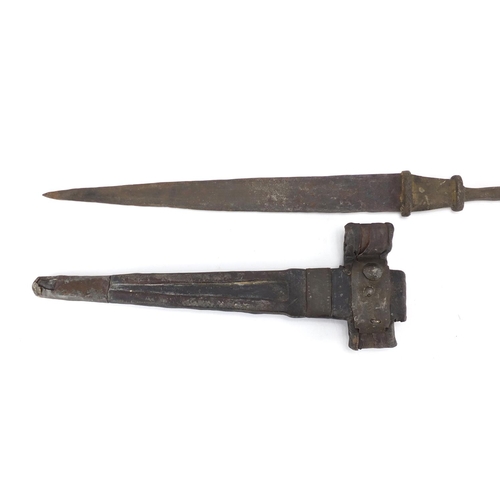 864 - Middle Eastern dagger with brass handle and leather sheath, 49cm in length